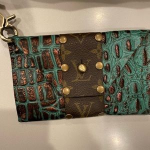 Refurbished Louis Vutton wristlet